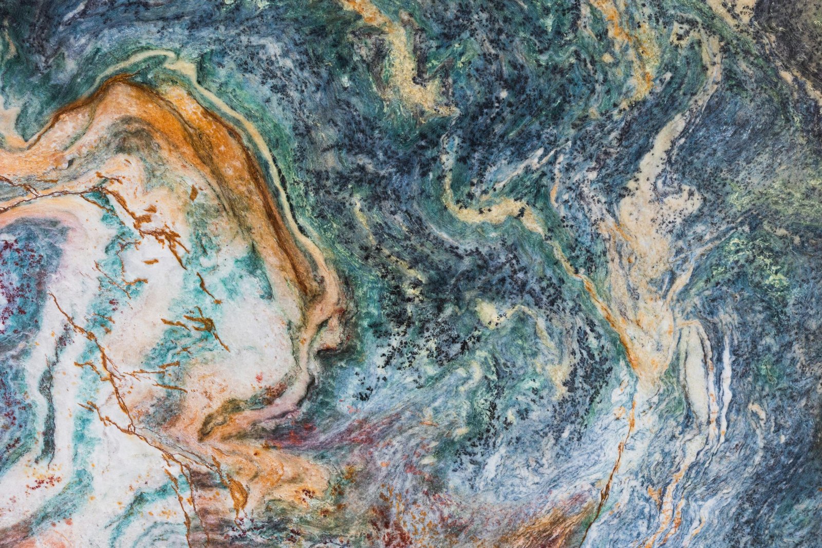 Detailed abstract texture of a colorful marble stone with vibrant patterns and hues.